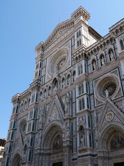 Fototapeta premium Florence Cathedral Duomo di Firenze with Brunelleschi’s dome and the Baptistery. exterior features intricate marble patterns in green, white, and pink, representing iconic Renaissance architecture