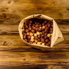 Brown and yellow cereal in a paper bag