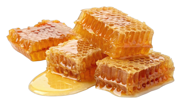 Delicious sweet honeycomb segments dripping with golden liquid honey against a dark surface