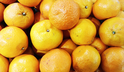 A pile of fresh oranges in the supermarket