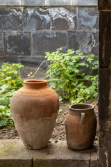 clay jugs stand in the garden
