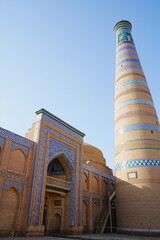 Islam Khoja Minaret at Walled Fortress known as Itchan Kala in Khiva, Uzbekistan -...