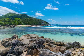 Rocks by the sea in a tropical beach