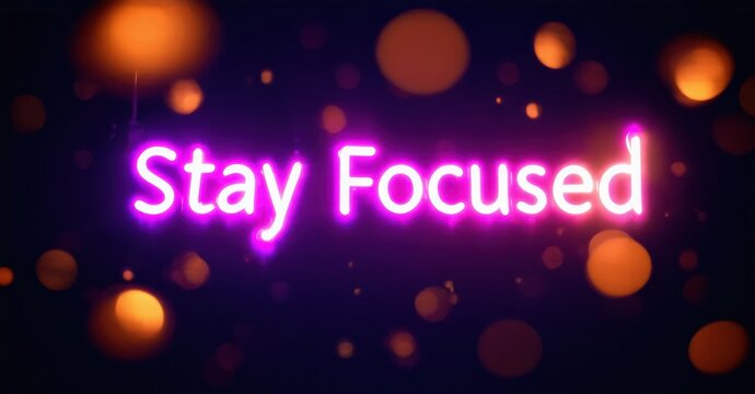 Bright neon text reads Stay Focused over dark purple background. Orange bokeh effects add visual interest, creating motivational image.