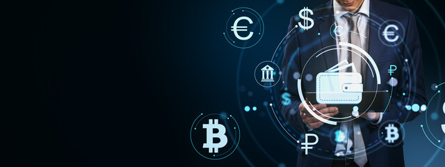 Businessman using tablet with digital wallet icon surrounded by cryptocurrency and finance symbols on futuristic blue background concept.