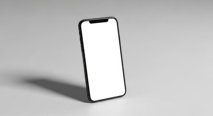 A black smartphone with a blank white screen, positioned on a light gray surface