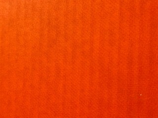 Orange background. Old dark orange color fabric or paper material. Fashion design texture	