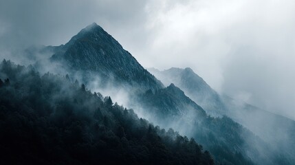 Misty mountain range shrouded in fog