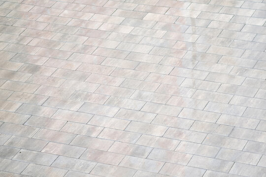 texture of the stone paving slabs in the form of square tiles