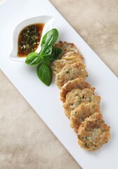 Close-up of oyster mushroom soybean pancake, a crispy and hearty Korean dish with golden texture created by master chef Hanshunseop. Photographed in Korea.