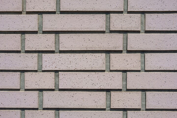 Light pink brick wall texture (淡いピンク色のレンガ壁)