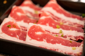 Close up of sliced brisket, raw meat. prepared for cooking