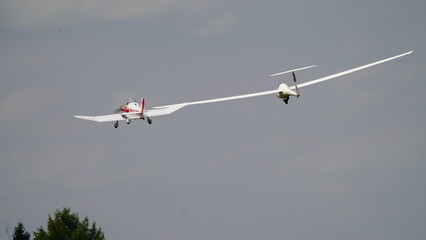 Tow plane with glider in the sky