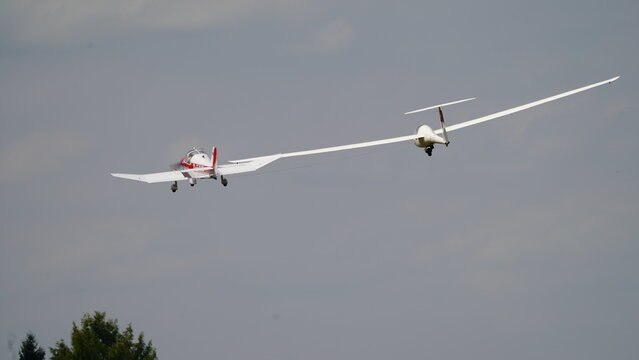 Tow plane with glider in the sky