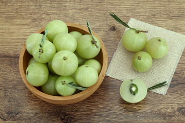 Fresh gooseberries in wooden bowl,Close up