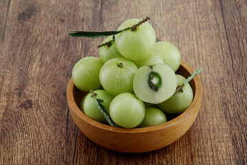 Fresh gooseberries in wooden bowl,Close up