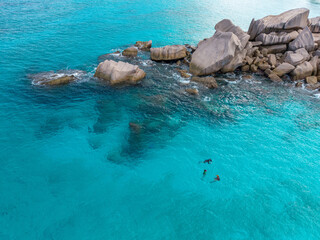 La Digue, Seychelles Aerial View. Iconic granite rock formations rising from the turquoise sea, showcasing the island’s unique and dramatic coastal landscape in La Digue, Seychelles.