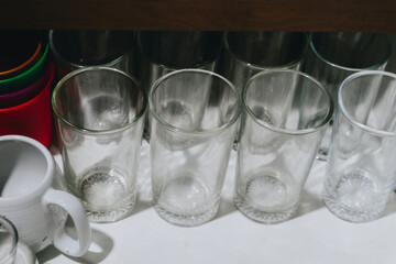 A Neatly Organized Display of Glassware and Kitchen Utensils Captured in a Drawer
