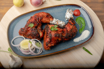 chicken tandoori  with salad served in plate. Tandoori Chicken is an Indian non vegetarian spicy food