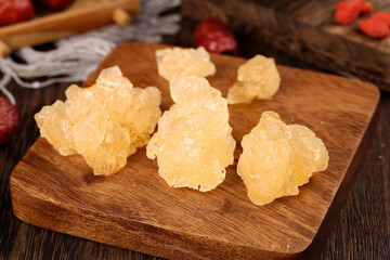 Yellow Rock Sugar Crystals on Wooden Board - Natural Cane Sugar Chunks for Cooking and Baking