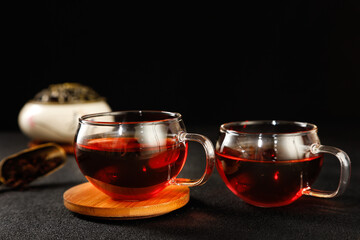Traditional Puerh Tea in Glass Cups - Ancient Chinese Tea Ceremony with Rich Amber Color and Wooden...