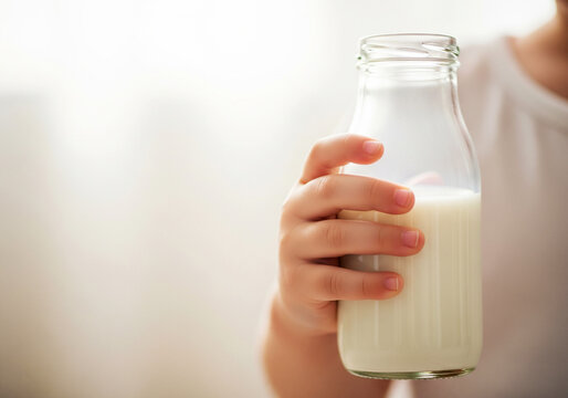 clean child holding milk bottle background