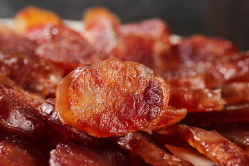 Air-dried cured sausage slices close-up with rich marbled texture and traditional meat preservation craftsmanship