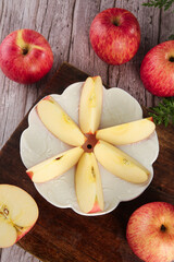 Fresh Red Fuji Apples from Shandong China with Sliced Pieces on Rustic Wood Background