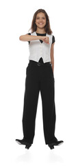 Teenage girl in tap shoes dancing on white background