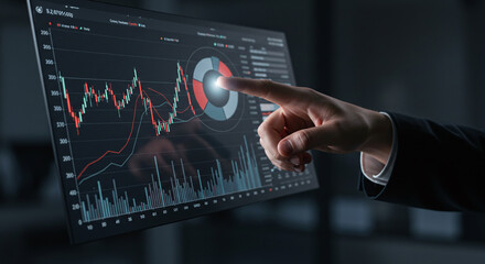 A hand interacting with a digital screen displaying financial charts and data analysis graphs shown