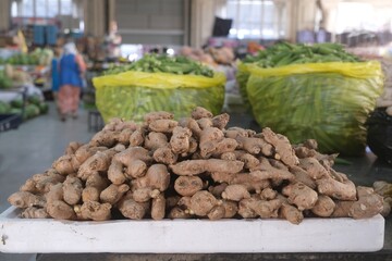 Close up of pile of fresh ginger roots on stall in bazaar in Dushanbe, Tajikistan