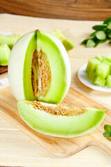 Fresh Green Honeydew Melon Slices on Wooden Board with Mint - Healthy Organic Fruit Photography