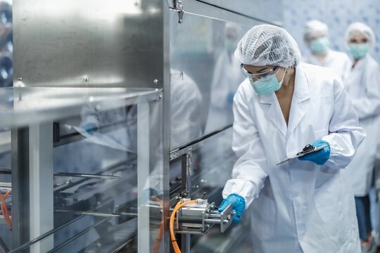 Industry inspector team working, QC staff work checking machine operation for safety and hygiene