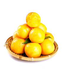 Fresh Golden Oranges in Wicker Basket on White Background