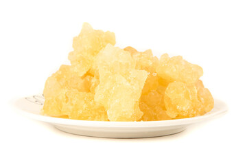 Handmade Yellow Rock Candy Sugar Crystals on White Plate - Traditional Sweet Confectionery Made from Cane Sugar