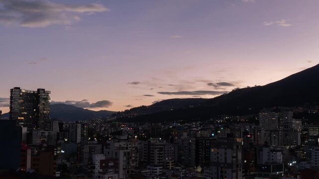 Time-lapse of Panoramic view of the northern part of Quito during the afternoon with the sky changing color until it gets dark - Ecuador