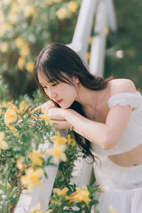 A Woman and Her Flora: A woman's serene gaze meets the vibrant embrace of nature, framed by radiant...