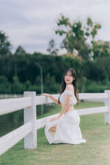 Serene Moments: A graceful woman leans gently, creating a striking tableau of beauty and grace. A...