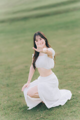 Serene Pose: A beautiful woman radiates happiness, a portrait of a person gracefully poses in a...