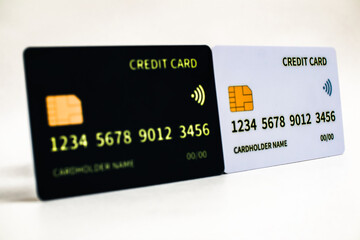 Two Credit Cards, one in black and the other in white, showcase financial payment options