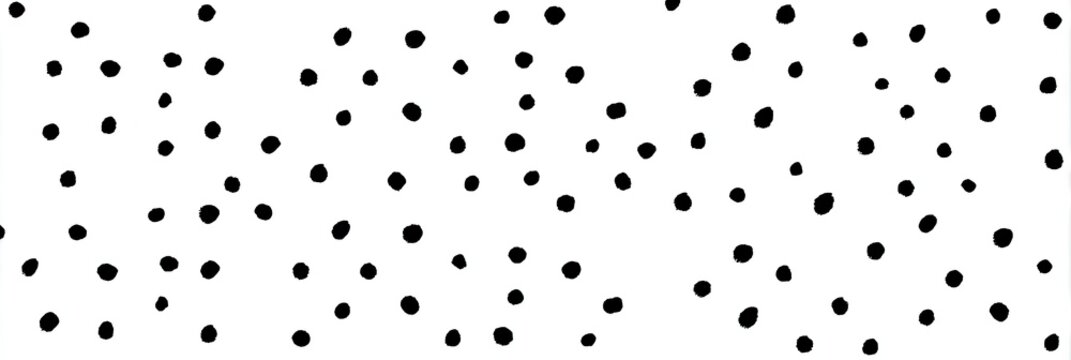 Abstract pattern of scattered black circles on white background