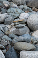 A pyramid made of flat stones on the river bank