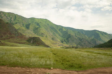Mountain landscape against a bright blue sky.