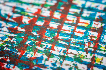 Extreme close up of colorful acrylic paint texture showing brush strokes. Selective focus.