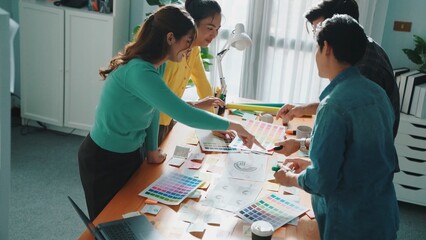 Top view of skilled designer explain and brainstorming idea for logo design and writing concept....