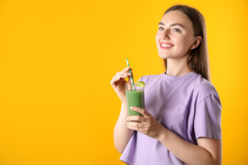 Woman with refreshing drink and straw on orange background, space for text