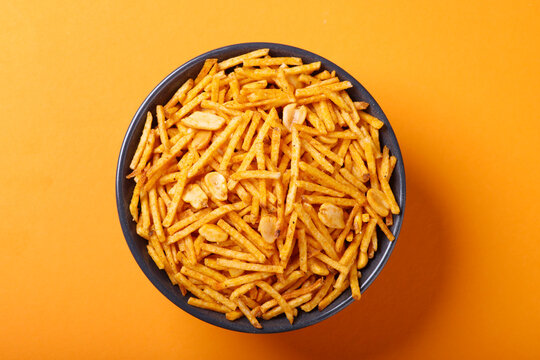 Indian snacks called farali chiwda isolated on orange background 