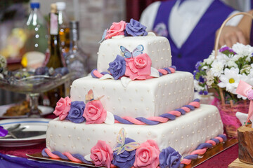 wedding cake, three tier cake, fondant cake, white fondant cake, rose decoration cake, pink roses cake, purple roses cake, square fondant cake, celebration cake, luxury cake design, handmade fondant c