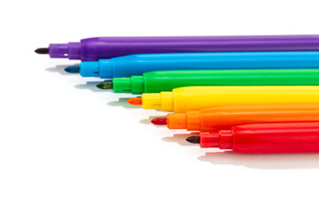Markers of rainbow colors isolated on white background