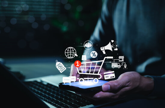 Online Shopping and E-commerce Technology Concept. Digital shopping cart with icons of sale, discount, delivery, payment, marketing, symbolizing online shopping, e-commerce, modern retail technology